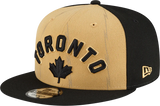 Men's New Era Tan/Black Toronto Raptors 2023/24 City Edition Official 9FIFTY Snapback Hat