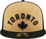 Men's New Era Tan/Black Toronto Raptors 2023/24 City Edition Official 9FIFTY Snapback Hat