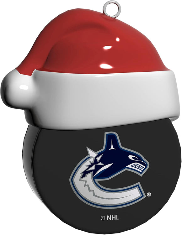 Vancouver Canucks Santa Hockey on Hockey Puck Ceramic Christmas Ornament By The Sports Vault