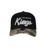 Men's Los Angeles Kings Script NHL New Era 9Forty A-Frame Snapback Hat - Black/RealTree