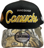Men's Vancouver Canucks Script NHL New Era 9Forty A-Frame Snapback Hat - Black/RealTree