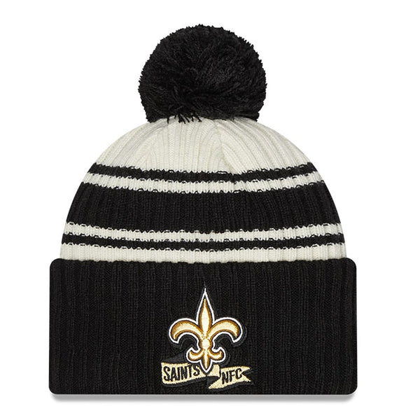 Men's New Orleans Saints New Era Cream/Black 2022 Sideline Sport Cuffed Pom Knit Hat