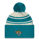 Men's Jacksonville Jaguars New Era Cream/Teal 2022 Sideline Sport Cuffed Pom Knit Hat